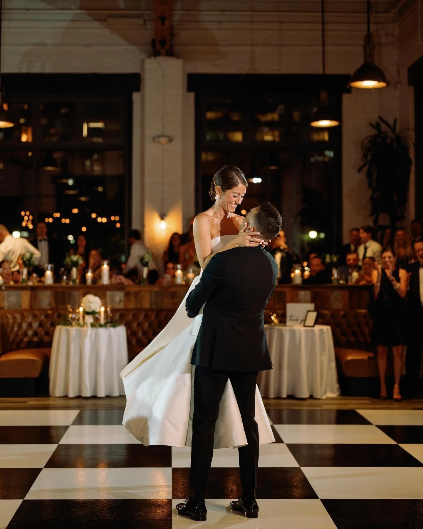 Couple sharing their first dance on a dance floor at an elegant indoor wedding reception in Phoenix