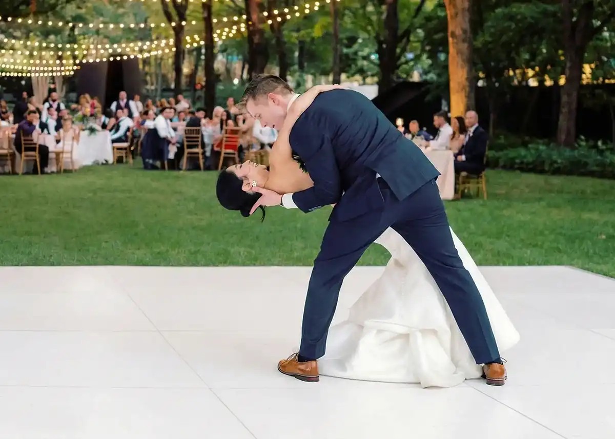 All white dance floor set up at an outdoor garden wedding reception near Phoenix